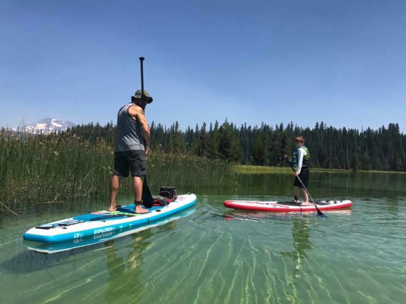 Jeremiah explores the shallows with his son while riding his favorite iSUP.