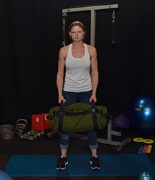 Michelle demonstrates Sandbag Around the World home position.