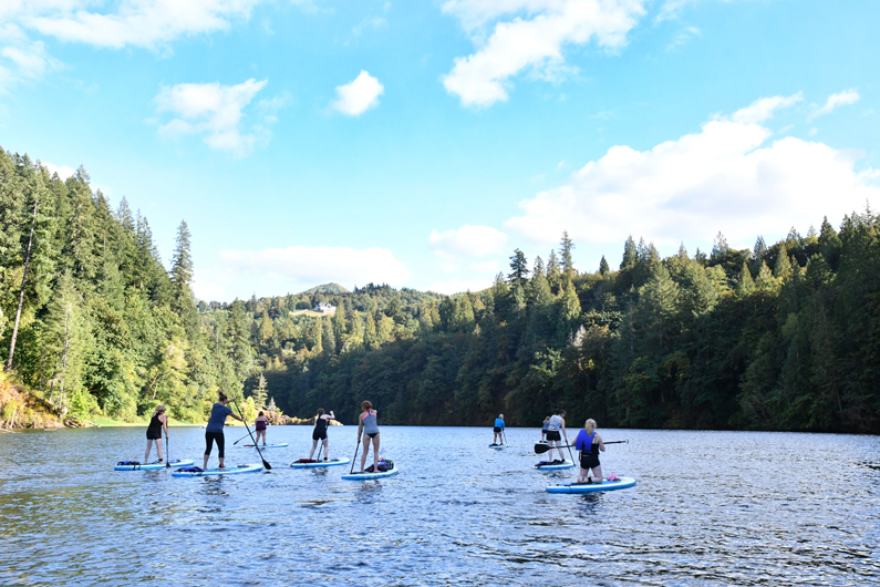 Women Stand Up Paddle Boarding at Lake Merwin on Red Paddle inflatable SUP Boards