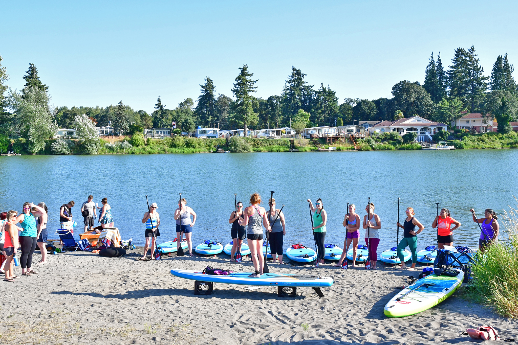 Large Group Womens Fitness paddleboarding at Horseshoe Lake Woodland Washington