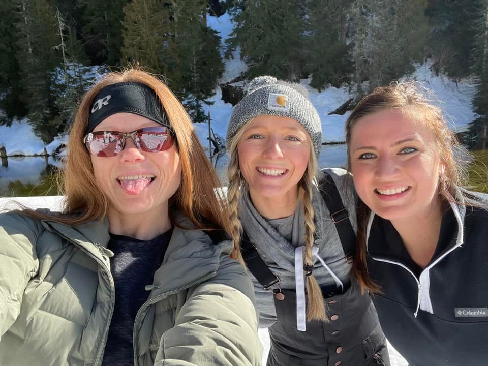 Michelle pose for her patented "tongue out at the camera" selfies with a couple fellow snowshoeing hikers.